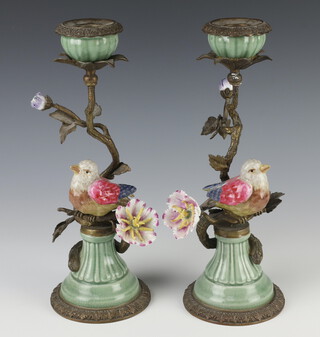 A pair of gilt metal mounted porcelain candelabra in the form of birds and flowers 28cm 