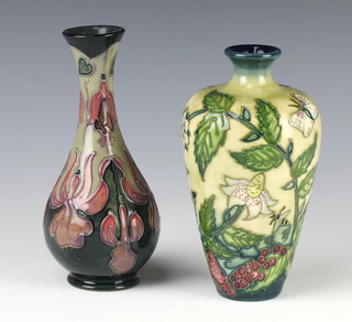 A modern Moorcroft blue ground baluster vase with waisted neck 17cm, a ditto cream ground vase with insects and flowers 16cm 