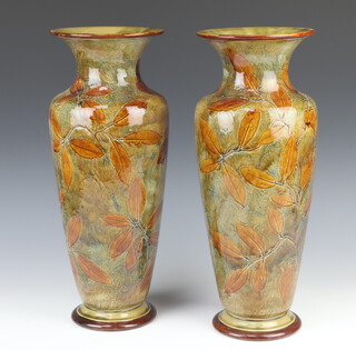 A pair of Royal Doulton oviform vases with flared necks decorated with leaves 40cm 