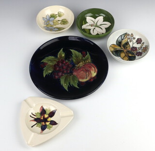 A modern Moorcroft cream ground Columbine ashtray together with 3 small bowls 15cm and a modern Moorcroft plate decorated with fruits 22cm  