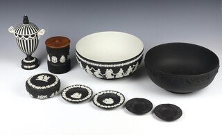 A Wedgwood black basalt classical urn and cover with mask handles and lid with acorn finial 21cm, 2 bowls, a lidded jar, box and cover, 4 dishes 
