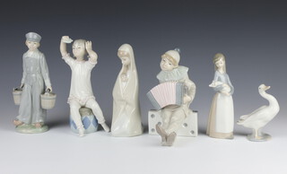 A Lladro figure of a stated clown 19cm, a boy water carrier 20cm, a seated girl 18cm, a kneeling mother and child 19cm, a girl holding a pig 16cm and a goose 10cm 