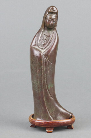 A 19th Century  Chinese bronze figure of standing Guanyin 17cm on a shaped hardwood stand 