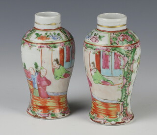 A pair of 19th Century famille rose baluster vases decorated with figures in pavilions 14cm, 4 character mark to bases 