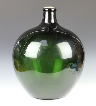 A green glass carboy, 55cm