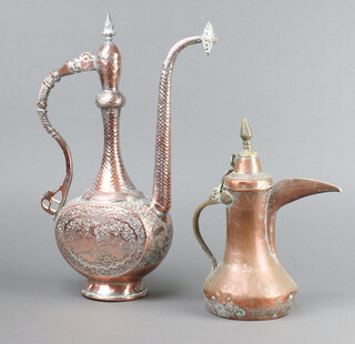 A Turkish Dallah copper coffee pot 28cm, together with an Eastern engraved and embossed coffee pot 40cm  