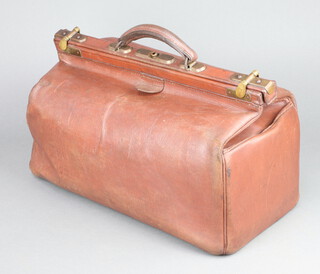 A brown leather Gladstone bag 19cm h x 24cm w x 45cm d  