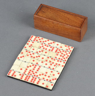 Twenty eight bone and ebony miniature dominoes contained in a mahogany box, the base marked Albert Leroy Brussels 