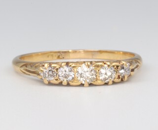 A yellow metal 18ct 5 stone diamond ring, approx. 0.35ct size Q 1/2, 3 grams