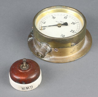 Great Western Railways a Vitreous porcelain and metal light switch marked GWR 3cm x 6cm, minor chip to back, together with a vacuum pump, the dial marked Inches of mercury 0-30 5cm x 13cm 
