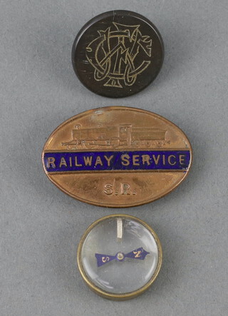 A Second World War double sided escape and evasion compass, a WWII railway service badge for Southern Railways and a horn hunt button 