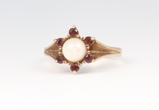 A yellow metal 9ct pearl and garnet ring, size P, 3 grams