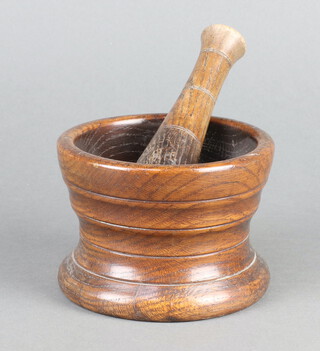A 17th/18th Century style turned oak mortar and pestle 10cm h x 12cm 