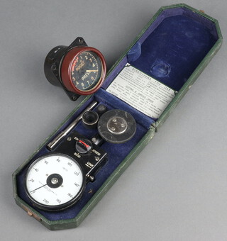 An Air Ministry altimeter marked 6A699 together with a Smiths tachometer, boxed 