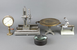 A Griffin and George Ltd. travelling microscope 37cm h x 43cm w x 17cm d, a circular metal pressure table together with an E.Bourdon's patent vacuum gauge and 2 large lenses 