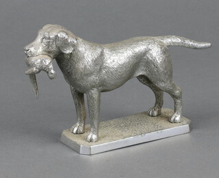 A cast metal car mascot in the form form a standing retriever with pheasant 11cm x 11cm x 4cm 