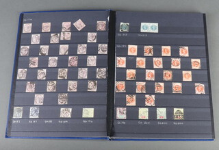 A Wessex Knight blue stock book containing a collection of penny reds, tuppenny blues, mint and used GB stamps - Edward VII to George VI
