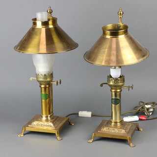 Two reproduction table lamps in the form of oil lamps marked Paris Orient Express 50cm h (one missing glass chimney) 