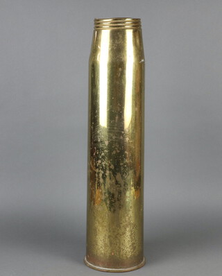 A large brass shell case the base marked 1960 64cm x 17cm diam.