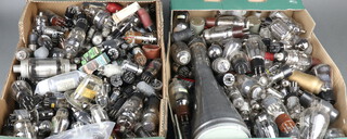 A collection of unboxed valves including some military, contained in 2 green fruit boxes