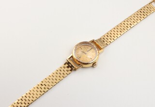 A lady's 18ct yellow gold Omega wristwatch and bracelet, gross weight including glass 19.7 grams 
