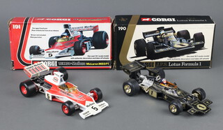 Corgi Toys, a die-cast 18:1 scale model of a J.P.S. Lotus Formula 1 car No 190, together with the Texaco Marlboro McLaren M23 F1 car No 191, both boxed with card inserts 