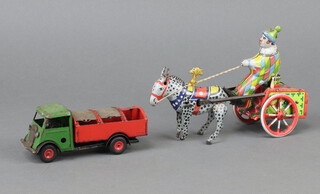 A tinplate Minic rubbish truck together with a wind up tinplate circus clown and horse 