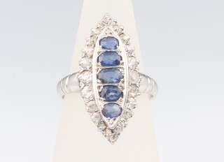 A white metal marquise sapphire and diamond ring, the sapphires approx. 1ct, brilliant cut diamonds approx. 0.75ct, size J, 3.5 grams 