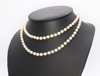 A strand of cultured pearls with a 9ct yellow gold pearl set clasp 74cm 