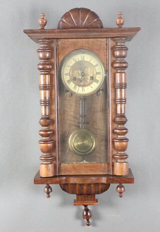A Vienna style regulator with 12cm paper dial, the centre embossed a bird, complete with grid iron pendulum and key 71cm h x 32cm w x 16cm d 