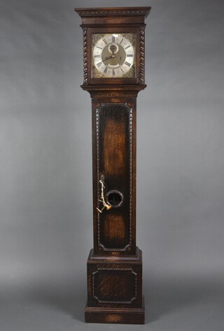 Gillett and Johnson of Croydon, a 1920's 8 day striking longcase clock, the 27cm gilt dial with silvered chapter ring, minute indicator, marked Gillett and Johnson Croydon, contained in a carved oak case complete with pendulum and key 212cm h  