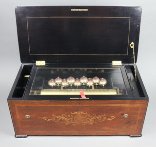 A Bremond style 19th Century cylinder musical box with 9 engraved bells, 38cm cylinder and 37cm comb, contained in an inlaid rosewood box with hinged lid, raised on bracket feet 27cm h x 65cm w x 32cm d 
