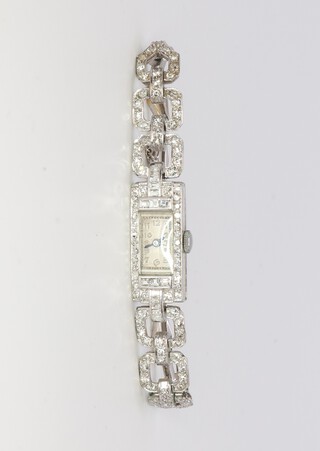An Art Deco white metal platinum diamond cocktail watch, gross weight including glass 19.3 grams, together with 1 spare link 