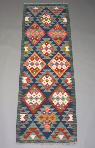 A green, tan and white ground Maimana Kilim runner with all over diamond design 188cm x 66cm 