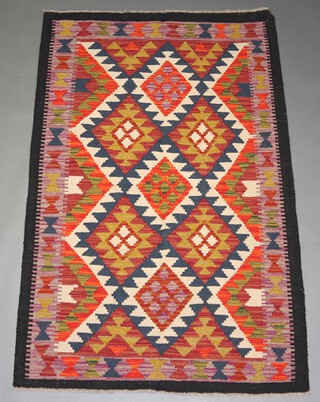 A black, white and orange ground Maimana Kilim rug with all over diamond design 158cm x 100cm 