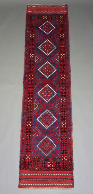 A red, white and blue ground Meshwani runner with 6 diamonds to the centre 244cm x 59cm 