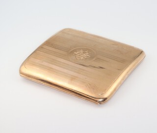 A 9ct yellow gold engine turned cigarette case with monogram 97.2 grams gross 