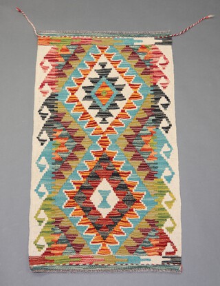 A white, turquoise and brown ground Chobi Kilim rug 98cm x 58cm 