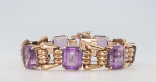 A Victorian style yellow metal 9ct amethyst 7 stone bracelet, 39.1 grams gross, the amethysts 12mm x 10mm, 18cm 
