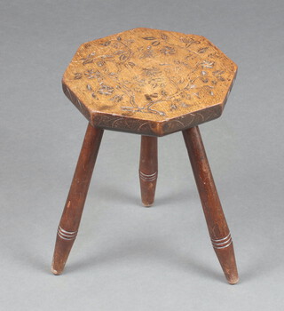 A 19th Century  octagonal carved hardwood stool raised on  turned supports 36cm h x 26cm w x 26cm d 