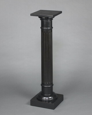 A Victorian ebonised fluted column/torchere with square top, raised on a square base 108cm h x 26cm w x 26cm d
