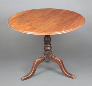 A 19th Century  circular bleached mahogany snap top tea table raised on baluster turned column and tripod base 68cm h x 88cm diam. 