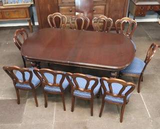 A Victorian style mahogany dining suite comprising oval extending dining table with 1 extra leaf, raised on turned and reeded supports 74cm h x 107cm w 195cm l x 239cm when extended, together with a set of 10 Admiralty tulip back dining chairs with over stuffed seats, raised on turned turned and reeded supports 90cm h x 47cm w x 41cm d (seats 24cm x 28cm) 