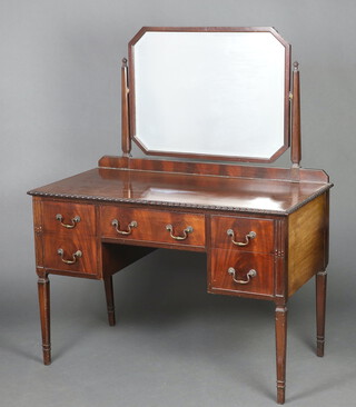 A 1920's Chippendale style mahogany dressing table with bevelled plate mirror fitted 1 long and 2 short drawers, raised on square tapered supports 142cm h x 114cm w x 58cm d 