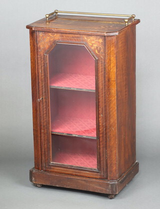 A Victorian inlaid walnut music cabinet with brass rail to the top, fitted shelves enclosed by glazed panelled door 89cm h x 51cm w x 33cm d 
