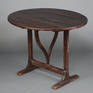 A 19th Century  circular Continental pine snap top table, raised on square supports with H framed stretcher, the top formed of 4 planks 71cm h x 92cm diam. 