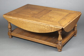 A 17th Century style rectangular oak drop flap coffee table raised on turned and block supports with undertier  48cm h x 79 cm d x 119cm wide when closed x 158cm when one flap raised x 196cm  when both are raised 