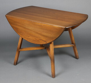 Ercol, a dark elm drop flap dining table raised on outswept supports with X framed stretcher 72cm h x 114cm w x 61cm 