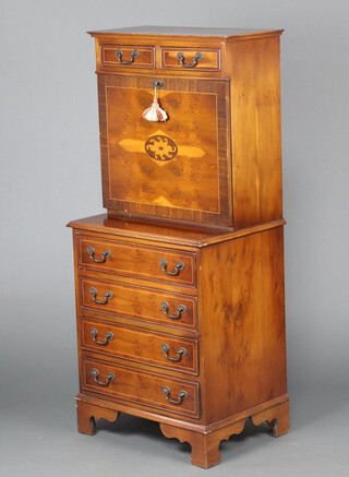 A Georgian style inlaid and crossbanded yew secretaire fitted 2 short drawers, the fall front above 4 drawers, raised on bracket feet 138cm h x 63cm w x 44cm d  