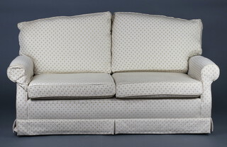 A two seat sofa upholstered in white material 81cm h x 178cm w x 76cm d (slight staining in places) 